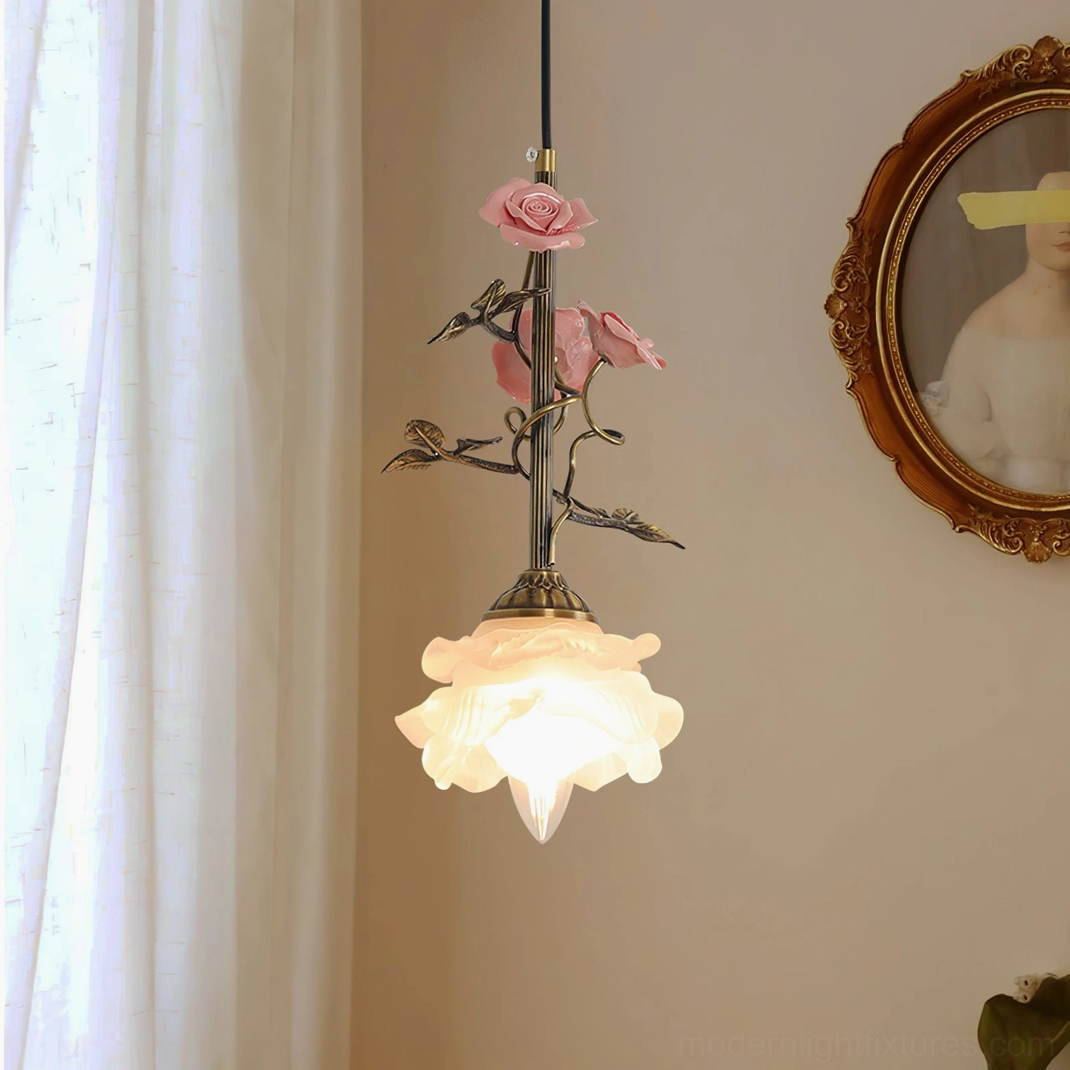Small model Rosavine pendant lamp with pink rose-shaped shade and brass hardware, indoor warm lighting display