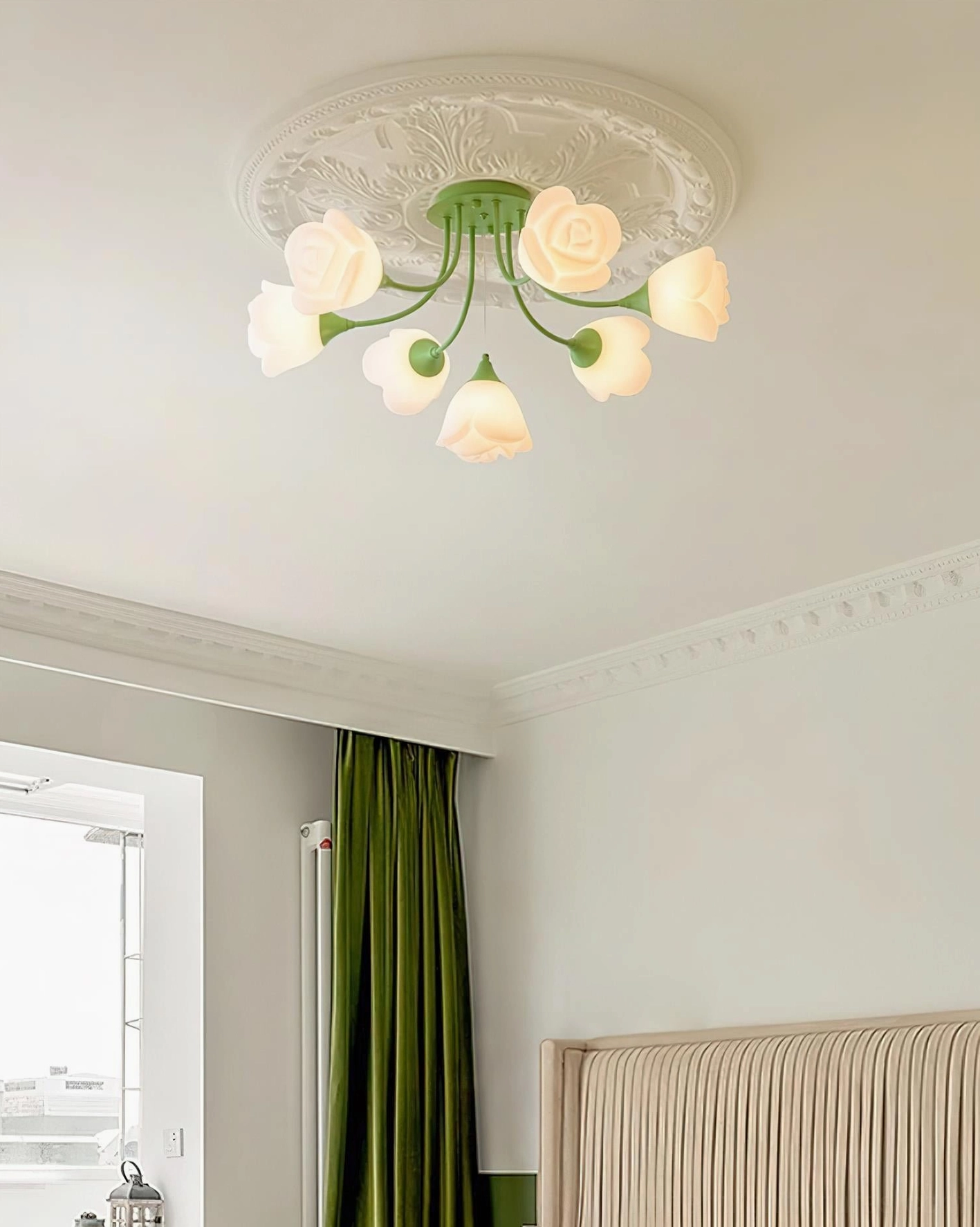 Rose cluster ceiling light showing green metal frame with acrylic petal shades and warm glow