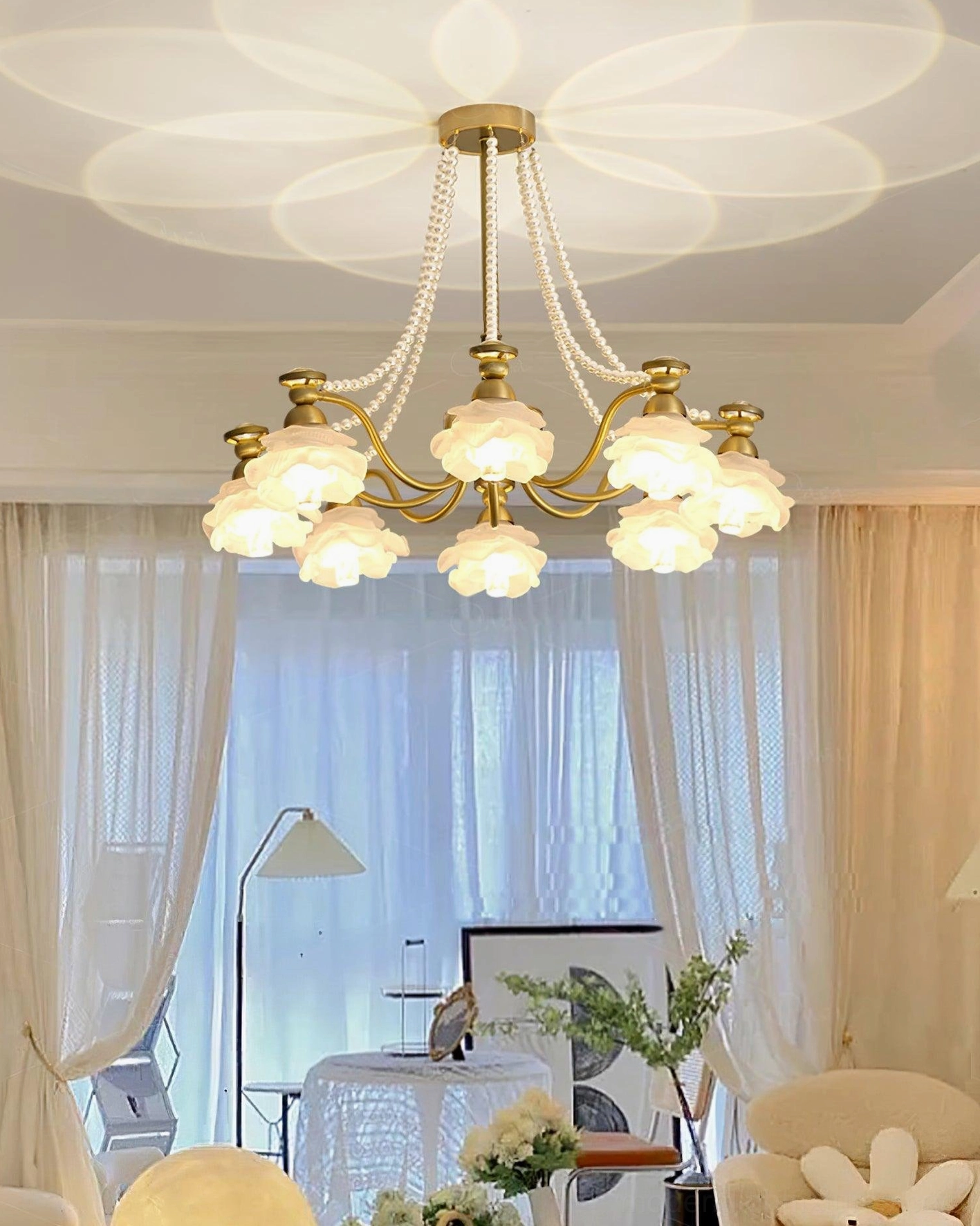 Rose glass chandelier with brass chains and pearl finish shades - architectural lighting design