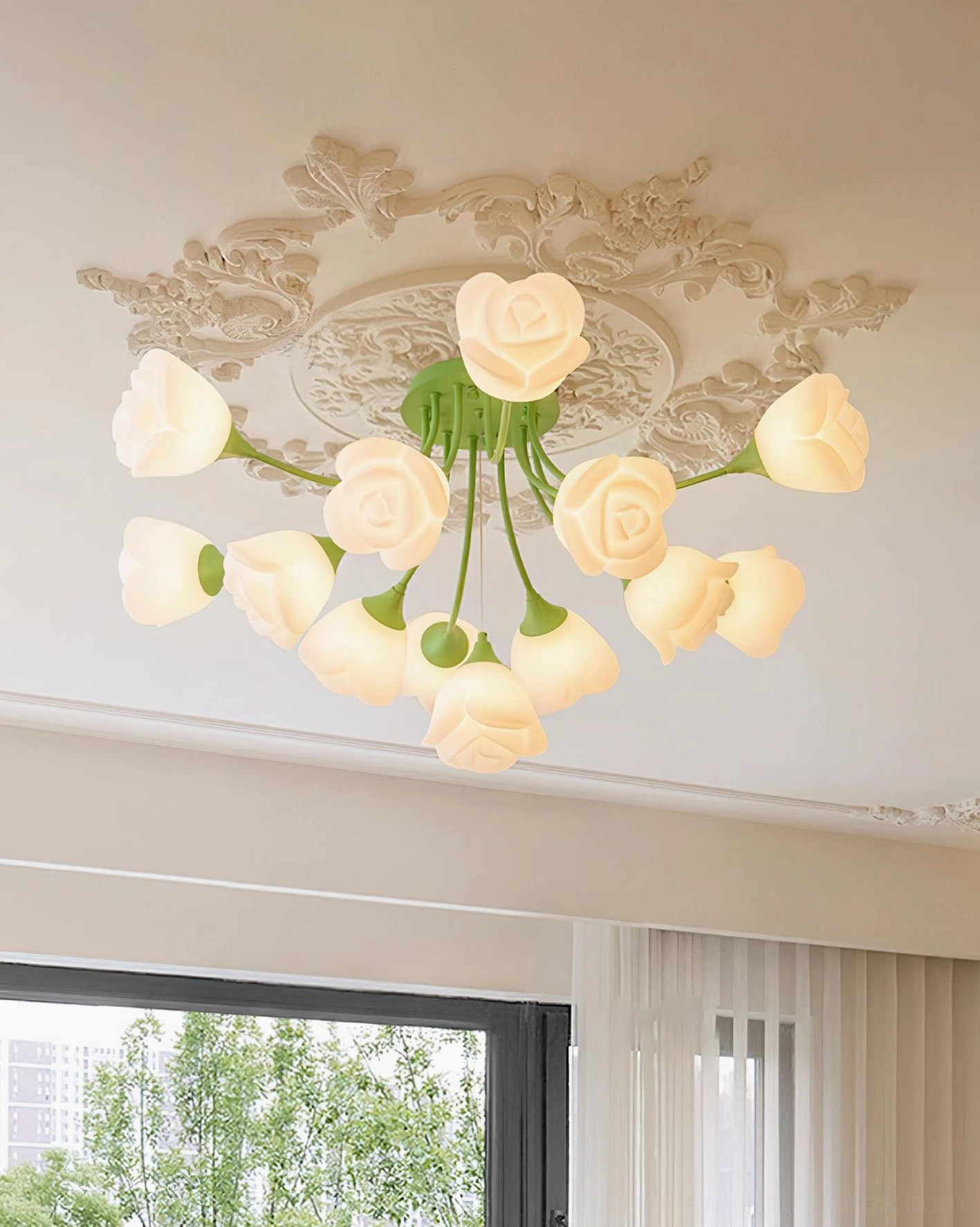 Rose ceiling light in French neoclassical style room with carved medallion and creamy petal shades
