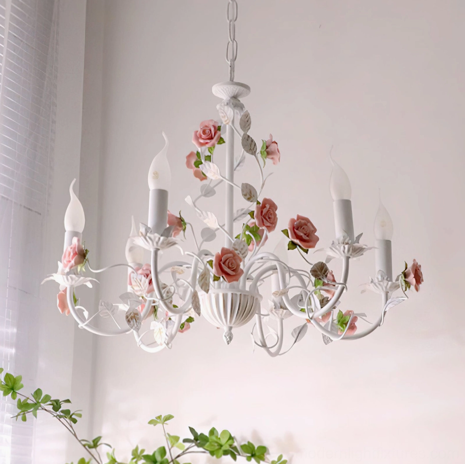 Rose ceramic chandelier hand-forged iron arms with delicate pink flower petals, close-up detail view