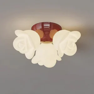 Modern rose ceiling light in wine red, three-quarter angle showing frosted white rose lamp shades