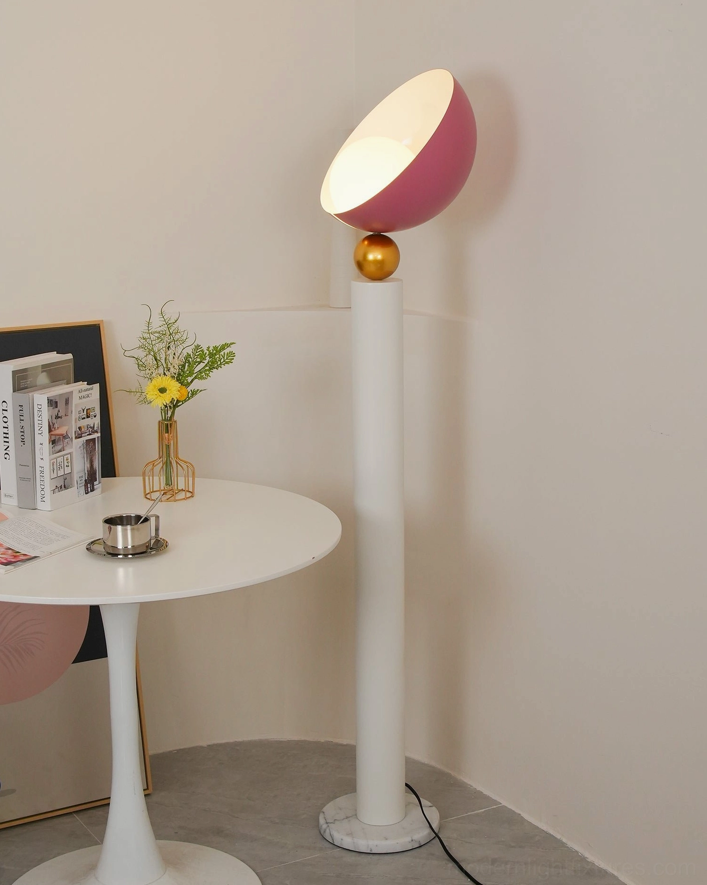 Rose pink half-sphere floor lamp warm glow lit side view dining corner with side table, intimate setting