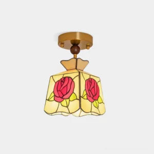 Rose Tiffany-style stained glass ceiling lamp with red rose patterns and brass gold base shown from front overhead angle