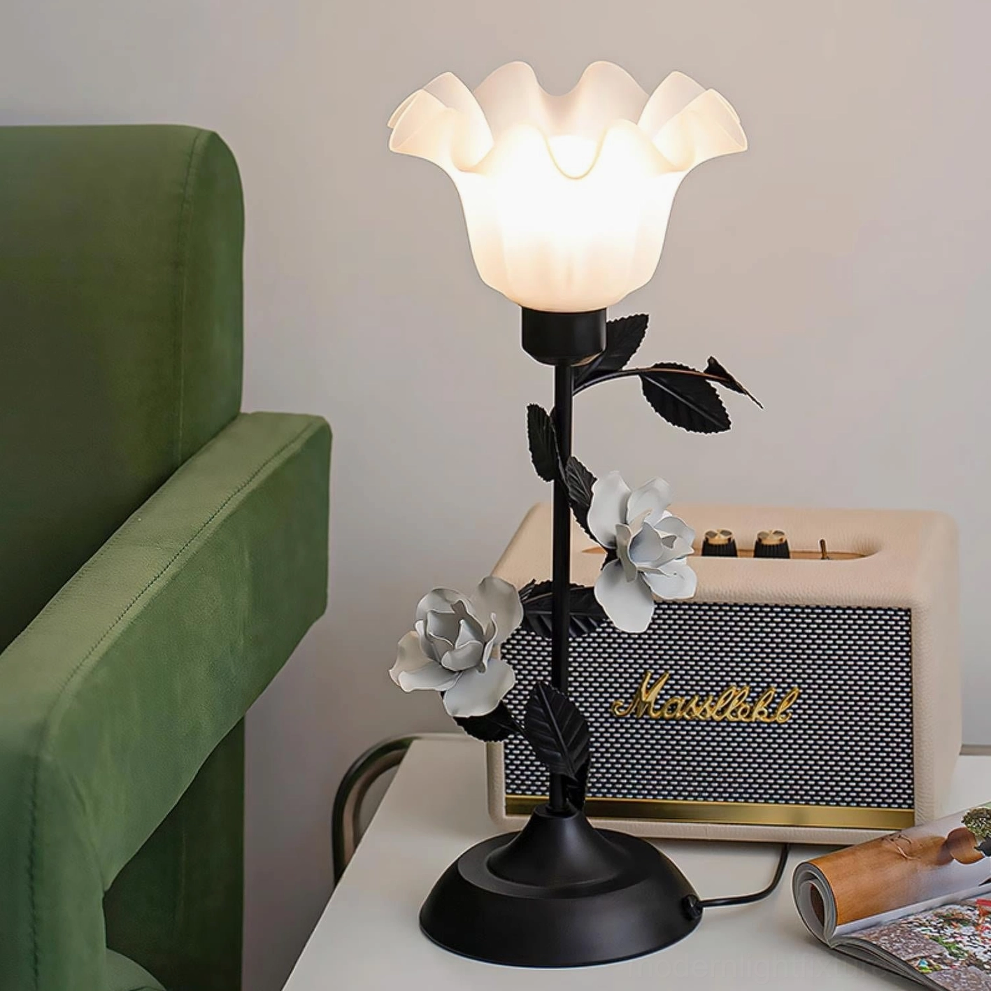 Roselith botanical table lamp side view next to green sofa in living room, paired with retro radio for boho design aesthetic