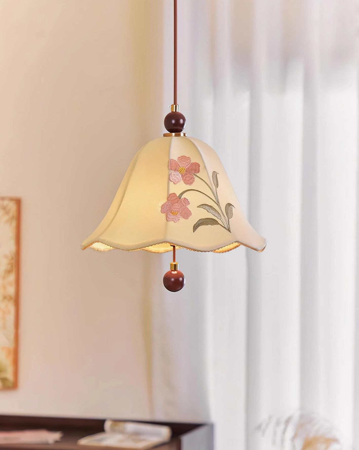 Roselle fabric pendant light side view highlighting floral embroidered shade and wooden bottom bead detail