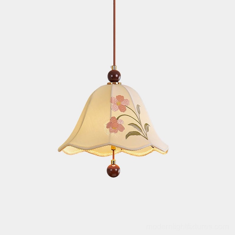 Roselle embroidered fabric pendant light with bell-shaped shade featuring pink floral embroidery on cream background, wooden bead accents