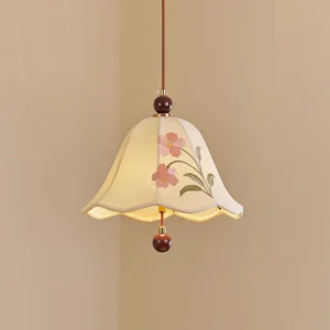 Roselle vintage fabric pendant light three-quarter view showing wavy shade edge and brown hanging cord against warm beige wall