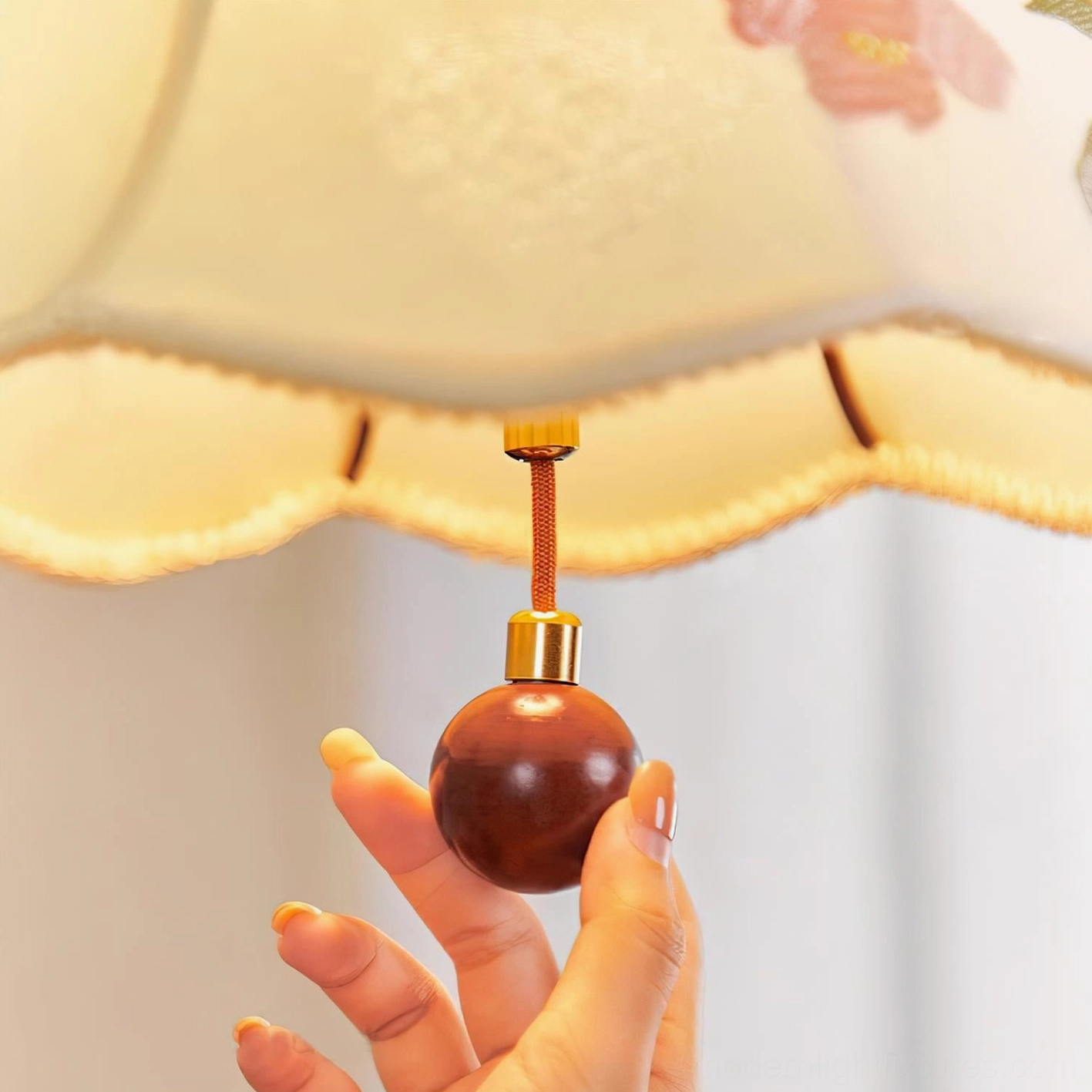 Roselle pendant lamp hardware detail showing wooden spherical pendant, brass connector, and scalloped shade rim