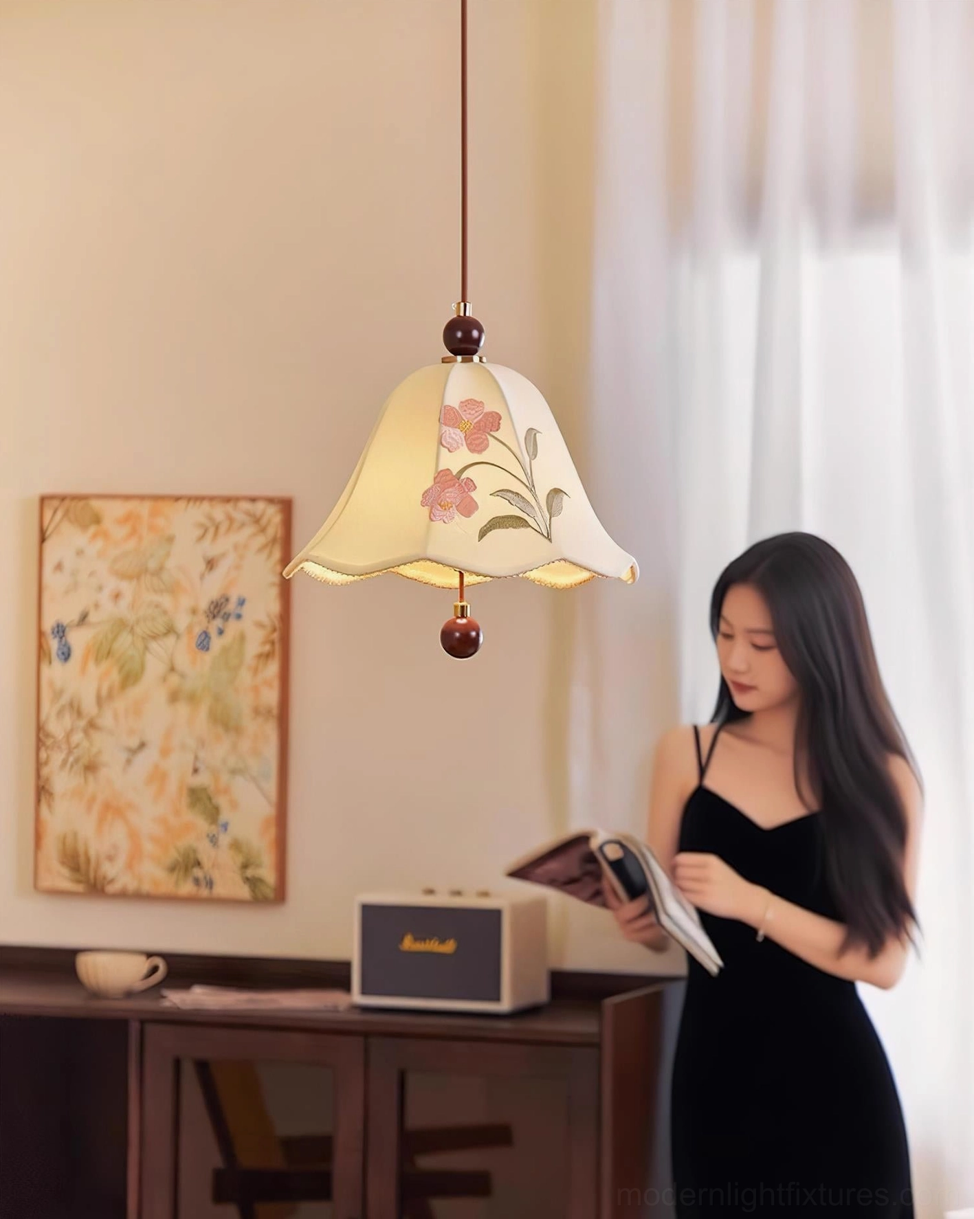 Roselle embroidered pendant light in cozy retro reading room with female reader, showcasing warm ambient lighting and interior design context