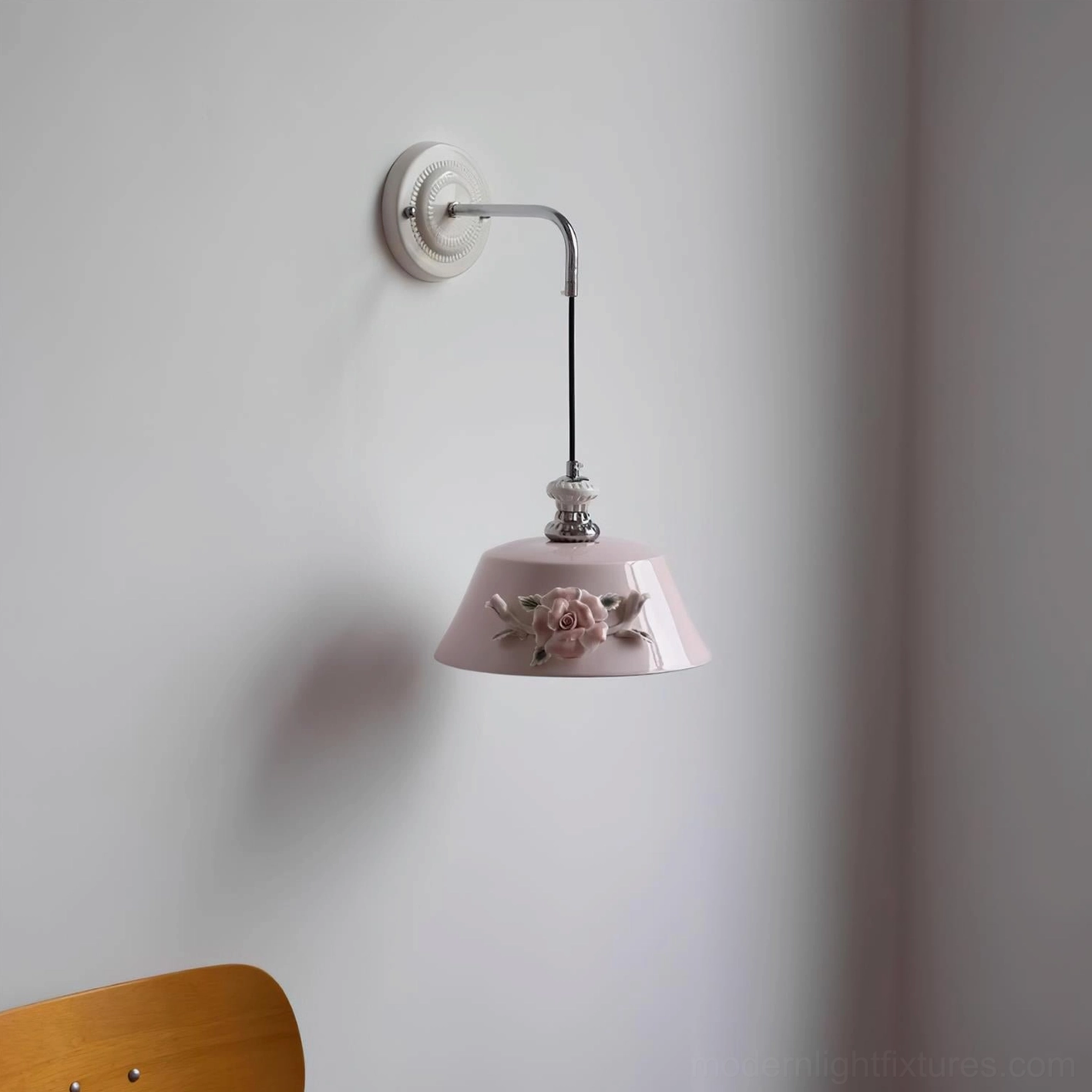 Roselune ceramic wall sconce mounted display showing floral shade design and chrome metal arm proportions