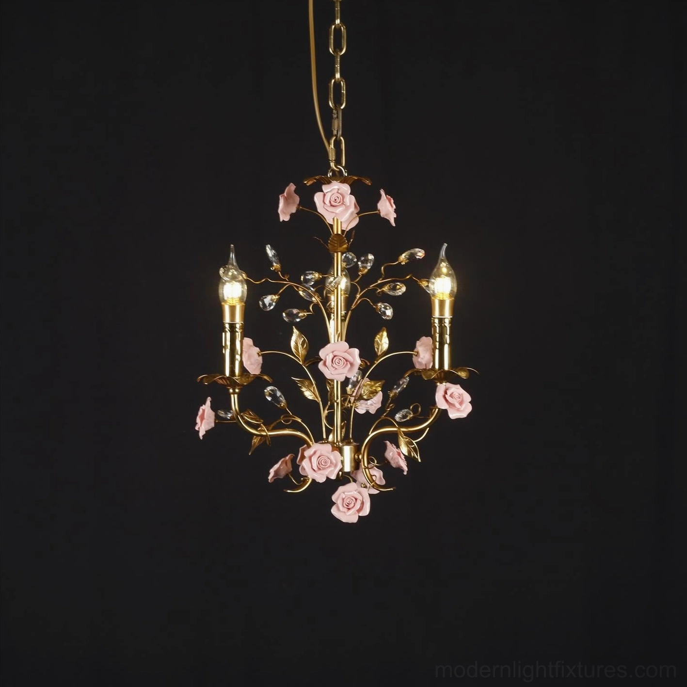 Roselune floral pendant chandelier with brass metalwork and crystal accents, dark background studio shot