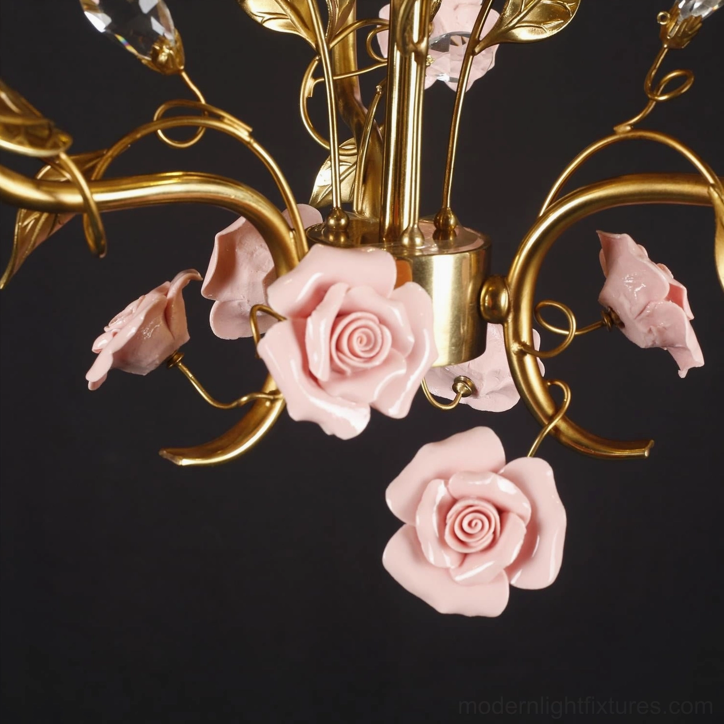 Close-up detail of Roselune pendant lamp showing curved brass arms and handcrafted pink ceramic rose petals