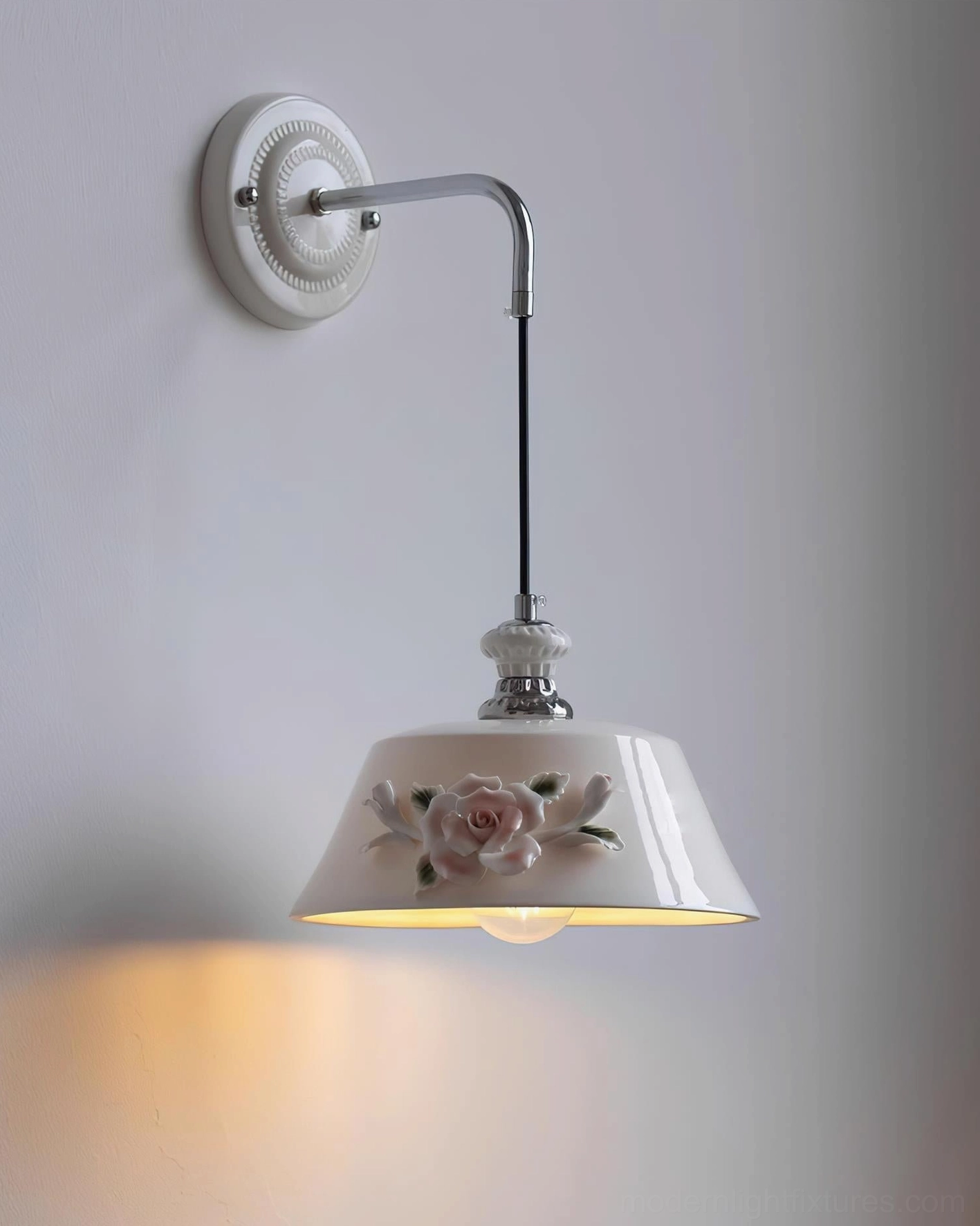 Roselune wall sconce side profile highlighting curved metal arm and sculptural ceramic shade architectural design