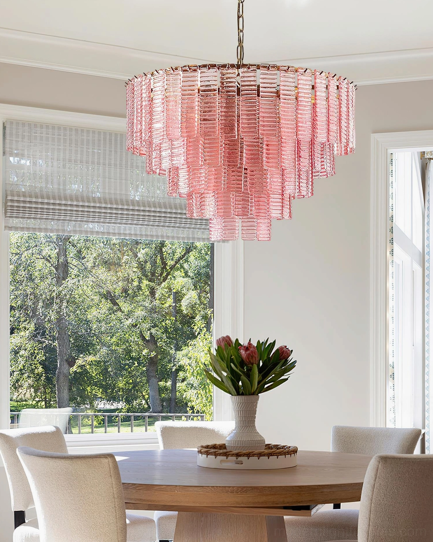 Rosewater tiered glass chandelier in room setting - modern pendant fixture above dining area, pink fluted glass with gold metal frame