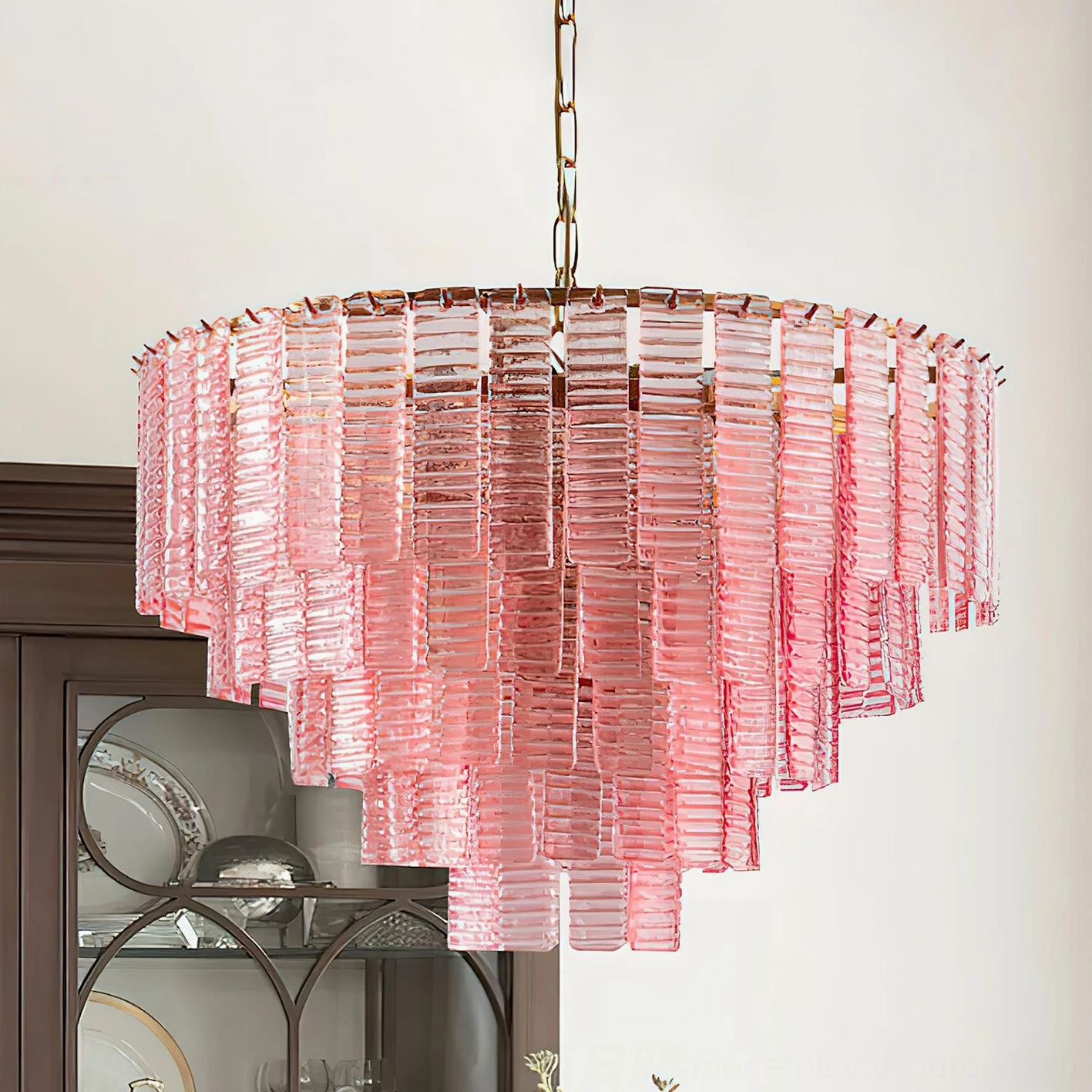 Rosewater tiered glass pendant chandelier three-quarter view - fluted pink glass layers with rose gold metal framework in luxury interior setting