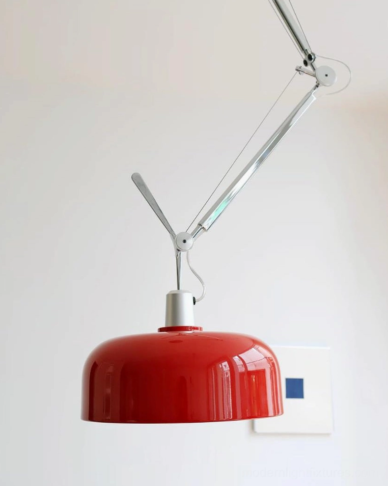 Rosso swing-arm pendant showing electroplated aluminum arm joints and canopy