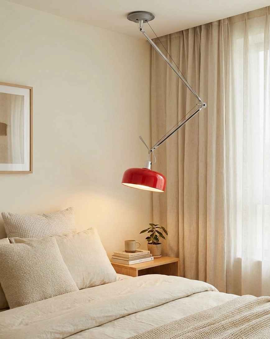 Articulating swing-arm pendant light detail showing aluminum arm and dome shade