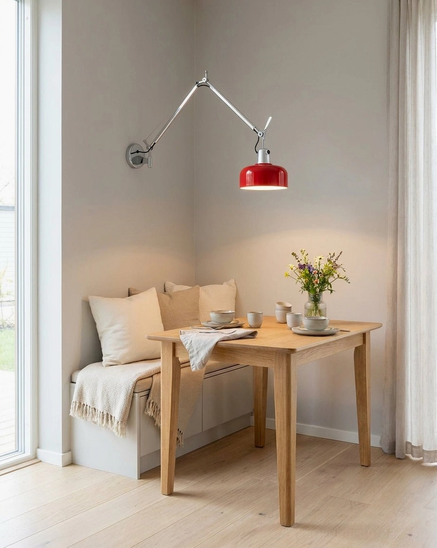 Cobalt blue dome shade swing arm sconce showing color coordination with modern interior design scheme