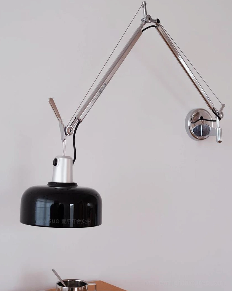 Rosso swing arm wall sconce in cream color mounted on neutral wall, low-profile design accent lighting