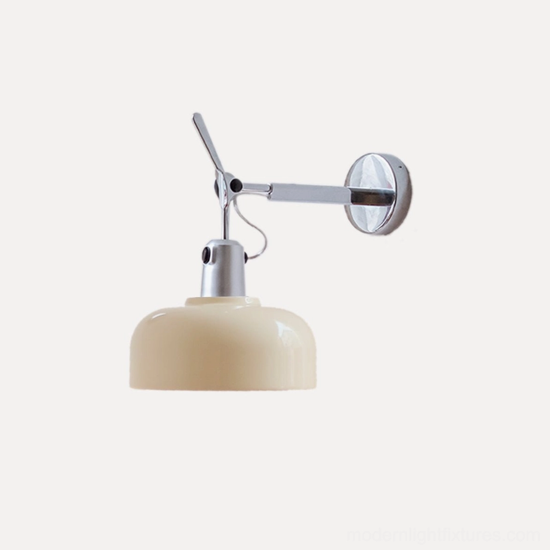 Rosso wall sconce with cream aluminum shade and chrome arm in styled interior setting