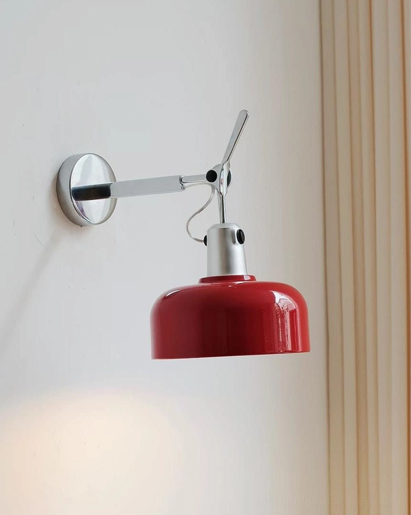 Rosso swing arm wall sconce mounted in modern bedroom interior with neutral walls