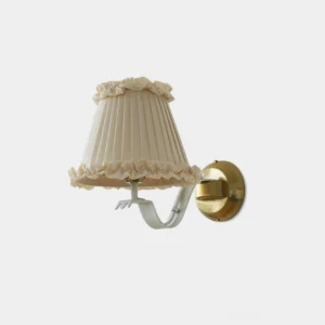 Rosvyn pleated fabric wall sconce with ruffled trim and brass gold mount, front view on white background