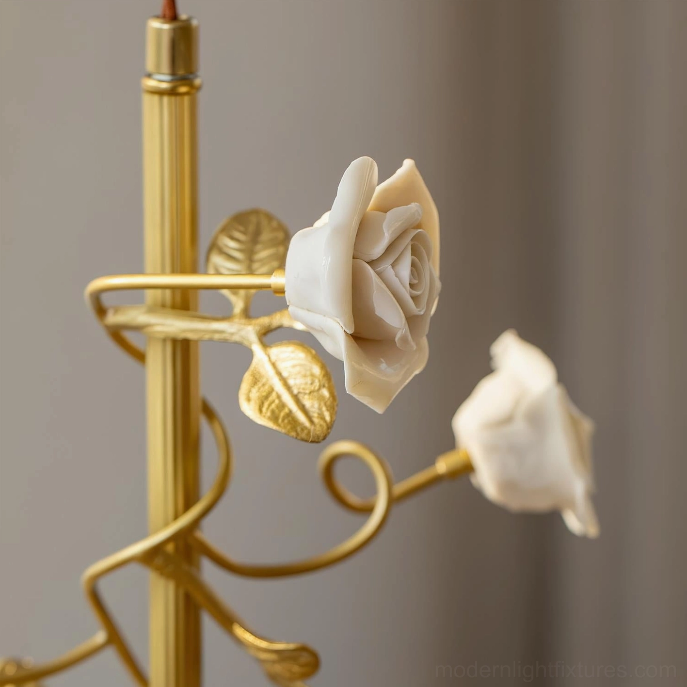 Close-up view of Rosy Reverie white ceramic roses and curved brass gold hardware on vintage floral pendant fixture