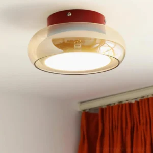 Rotan ceiling light installed in modern bathroom with orange shower curtain, showing warm 3000K glow and damp-rated installation