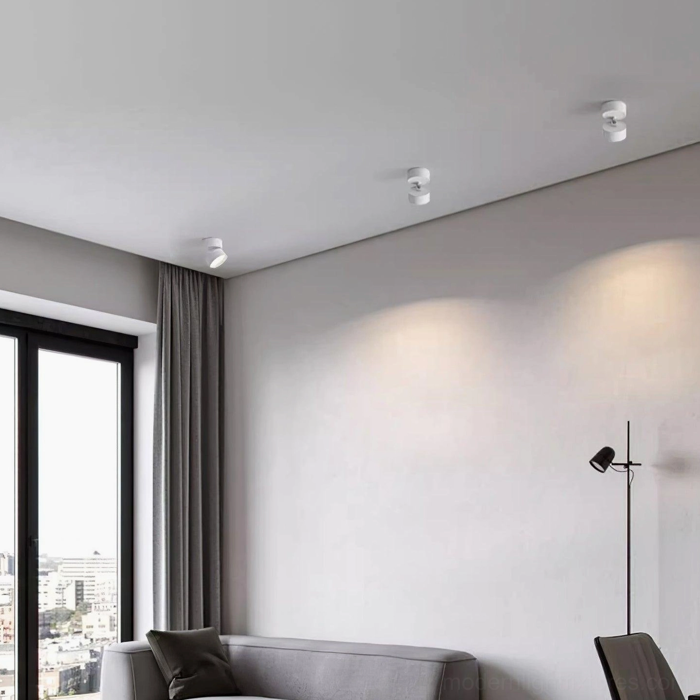 Close-up detail of rotatable surface spot light showing aluminum construction and flush-mount design precision