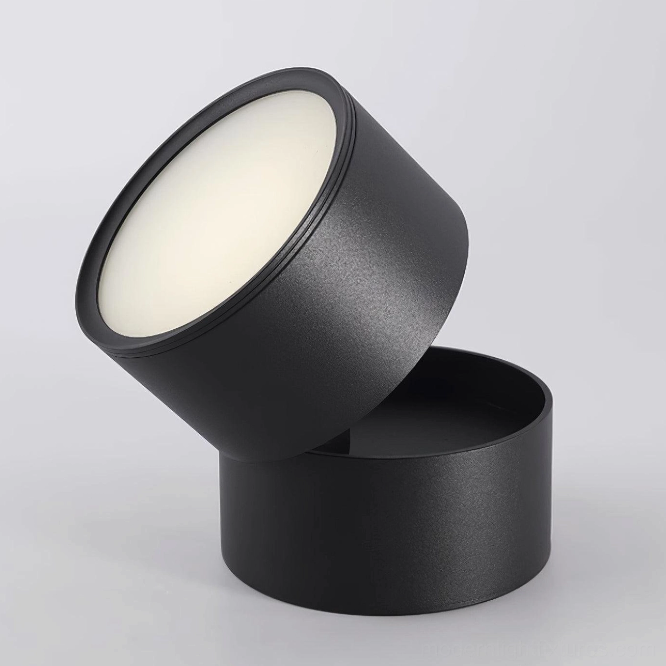 Contemporary interior design showcase of rotatable surface spot lights integrated into modern ceiling system