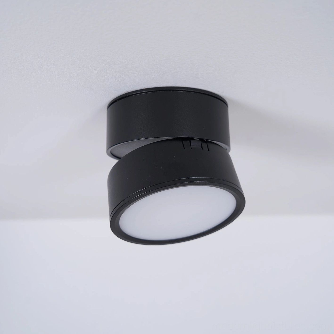 Rotatable spot light system installed across ceiling demonstrating complete directional lighting solution