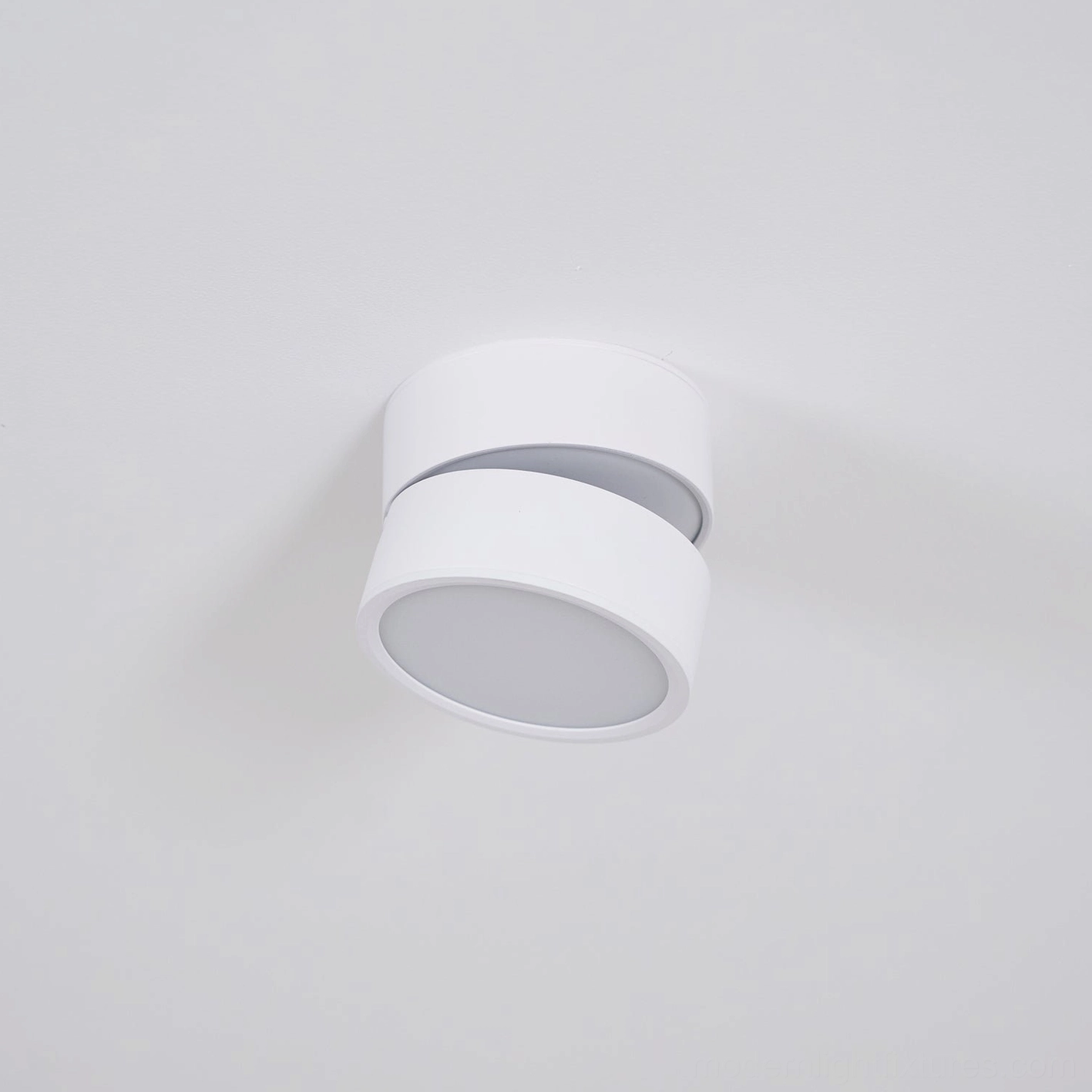 Rotatable surface light installation demonstration with adjustable angle positioning for artwork and accent zones