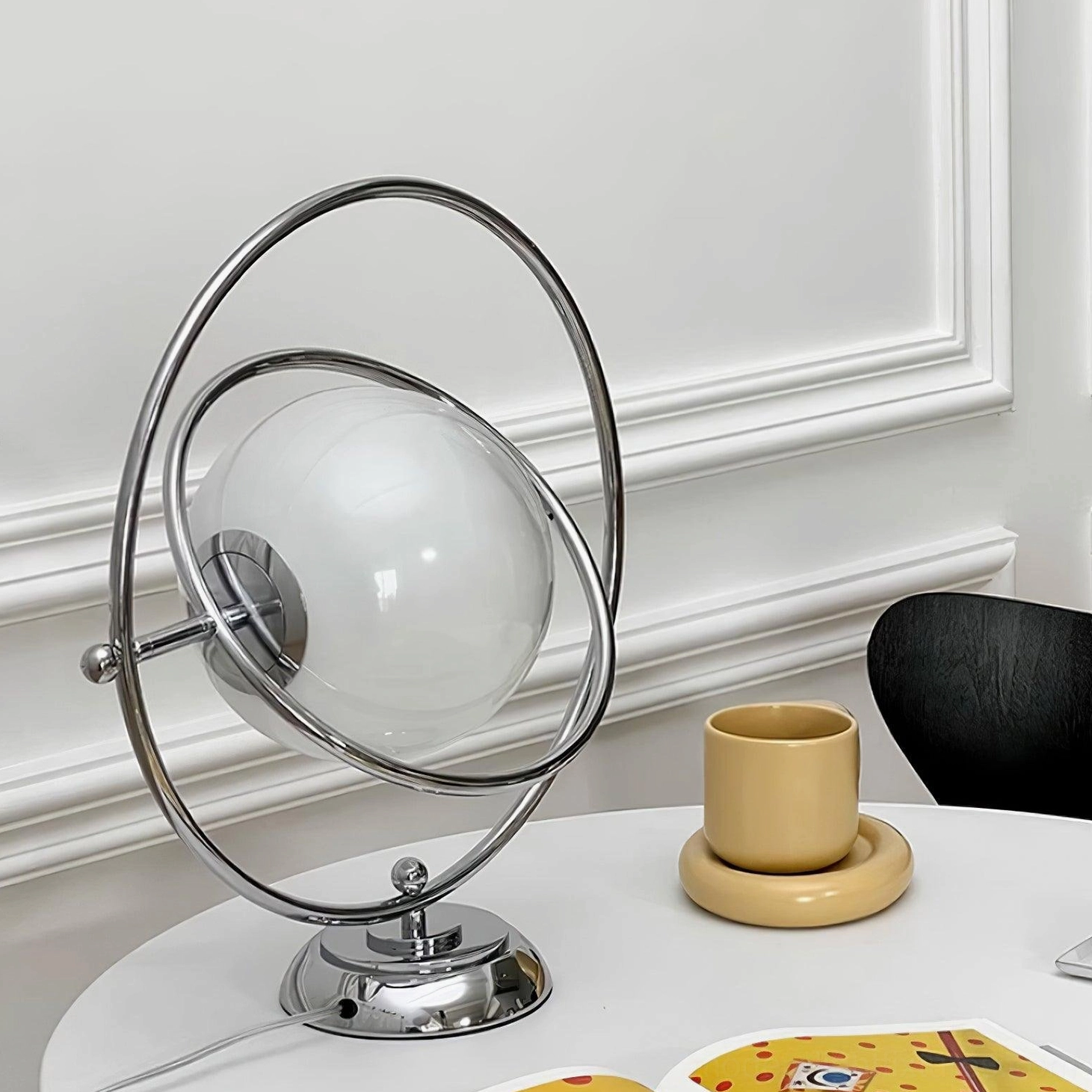 Rotating globe table lamp soft white light ambient evening setting
