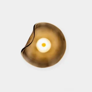 Round Nebulae modern wall sconce with amber glass diffuser - overhead flat product view on white background