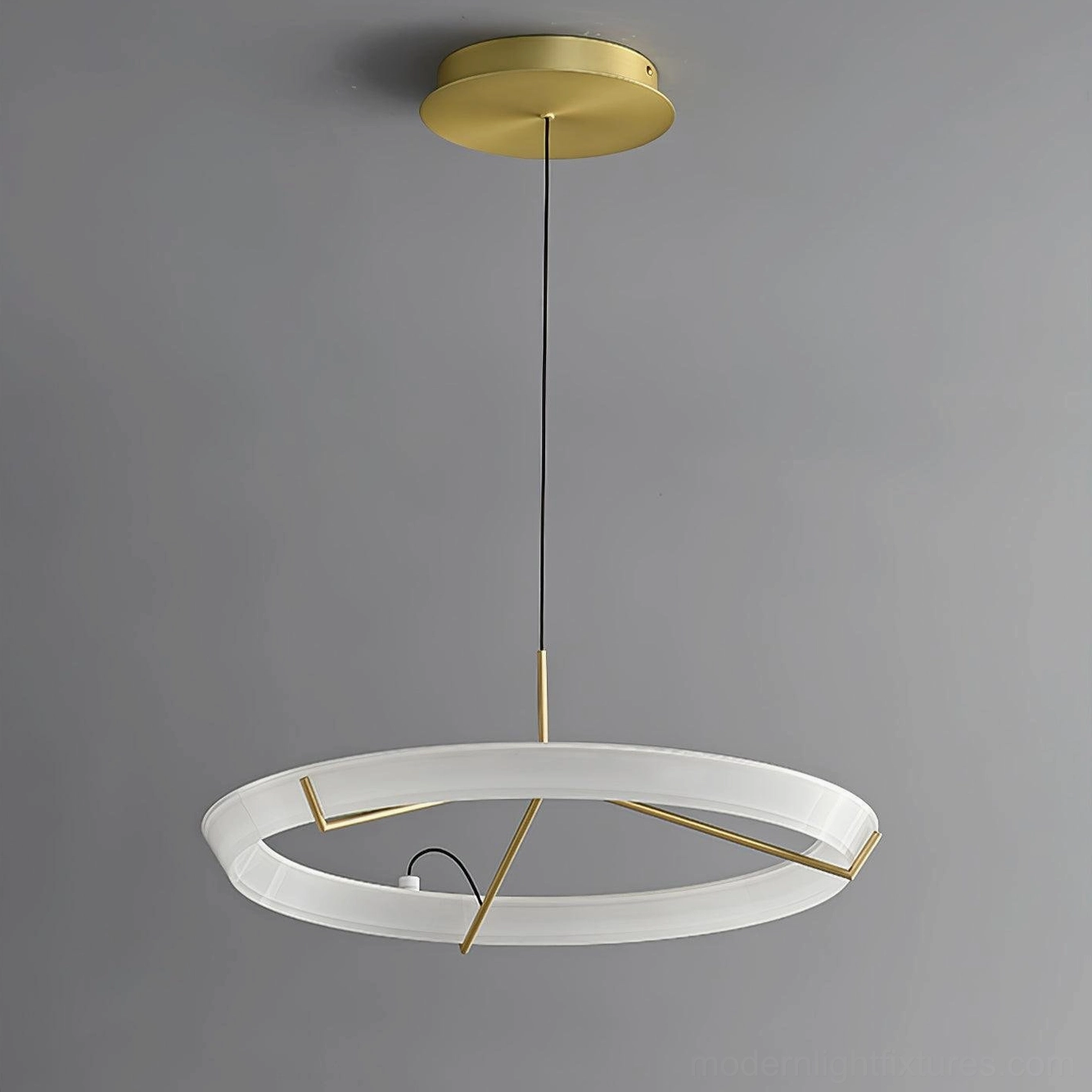 Single round ceiling pendant light with brass gold canopy and black suspension cord overhead view