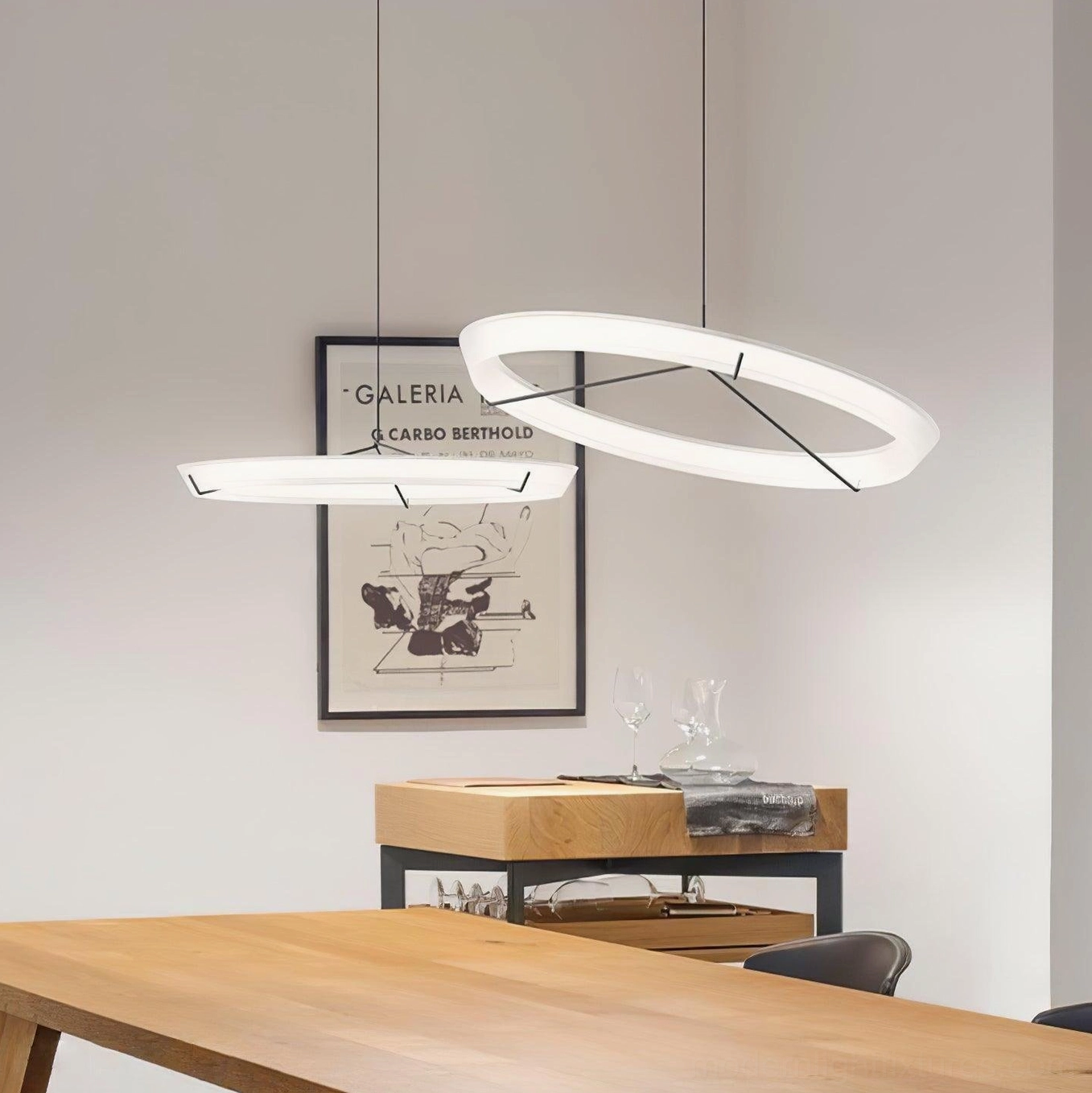 Modern round acrylic pendant light with brass support structure and minimal aesthetic