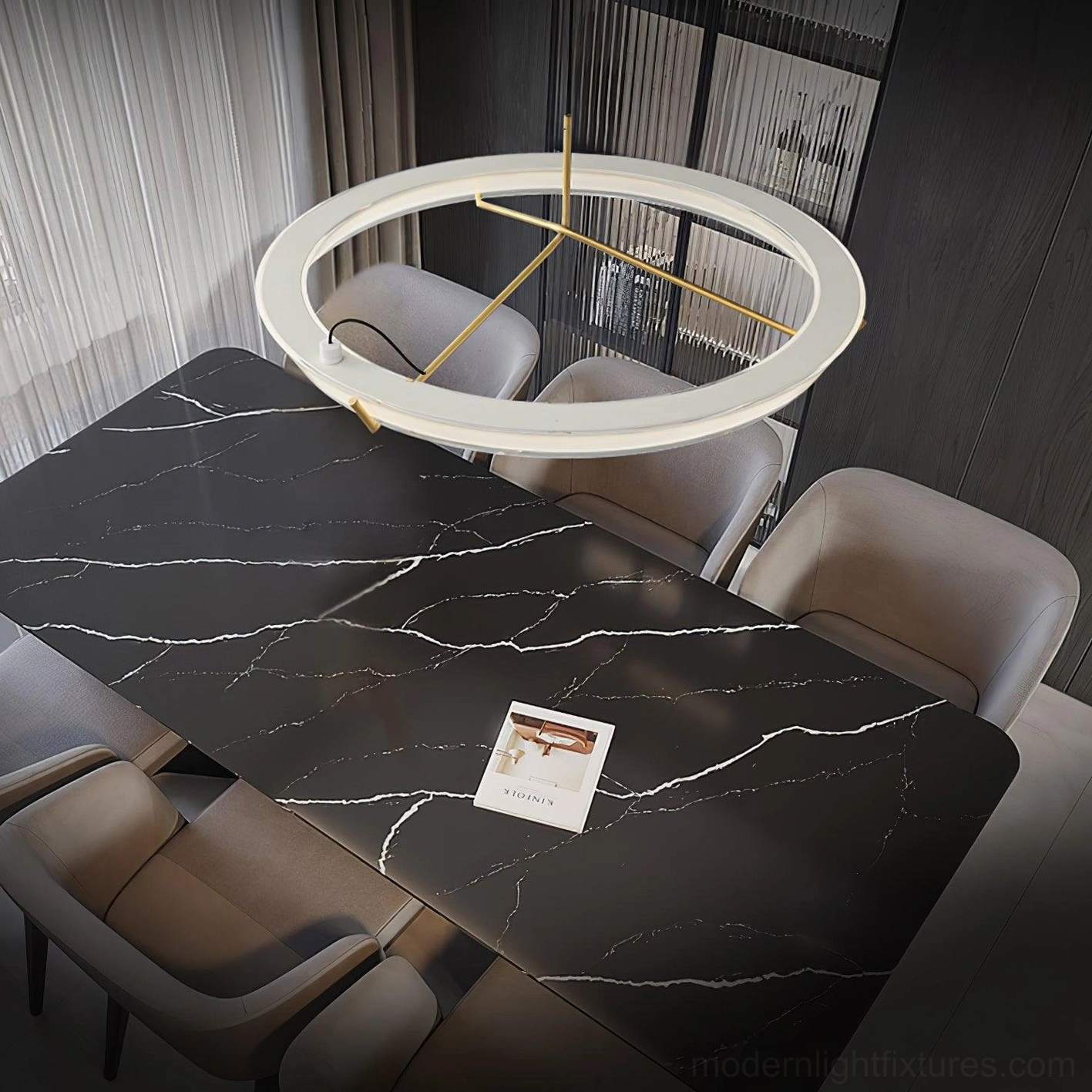 Luxury dining room with single round LED pendant light above marble table and brass frame