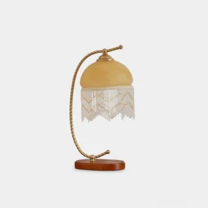 Roussillon Tassel Table Lamp vintage brass twisted arm frosted glass shade with beaded tassel wooden base front view studio shot
