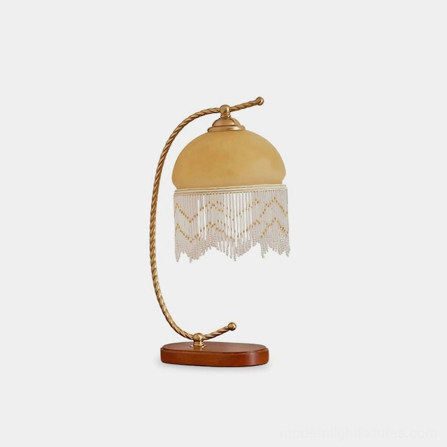 Roussillon Tassel Table Lamp vintage brass twisted arm frosted glass shade with beaded tassel wooden base front view studio shot