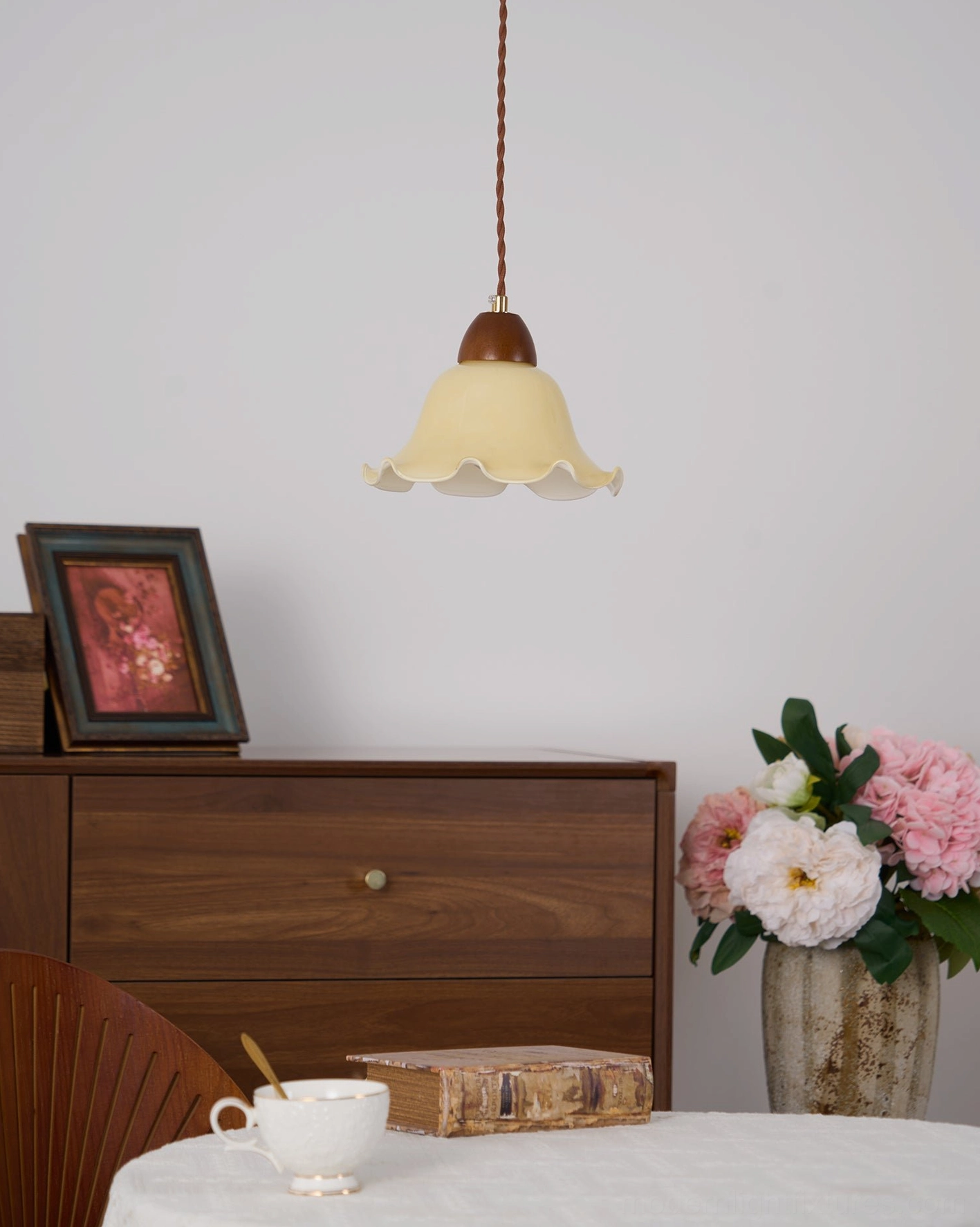 Rowan flower pendant light in modern minimalist interior, warm illumination creating ambient glow
