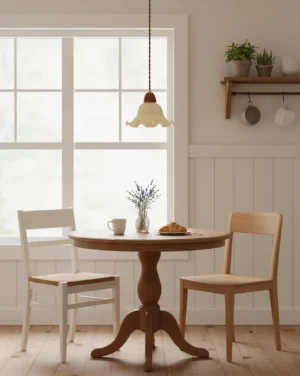 Modern flower pendant lamp installed above round dining table in farmhouse kitchen, warm ambient lighting