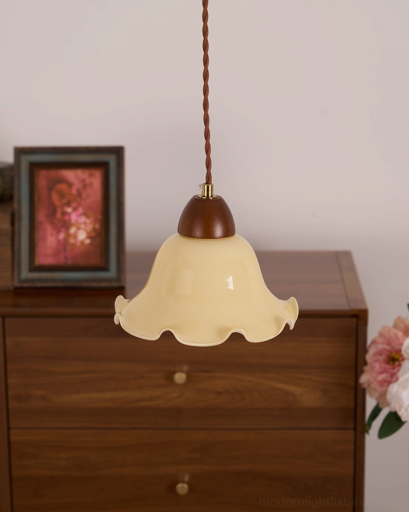 Single rowan flower pendant lamp hanging in cozy home office space above desk work area