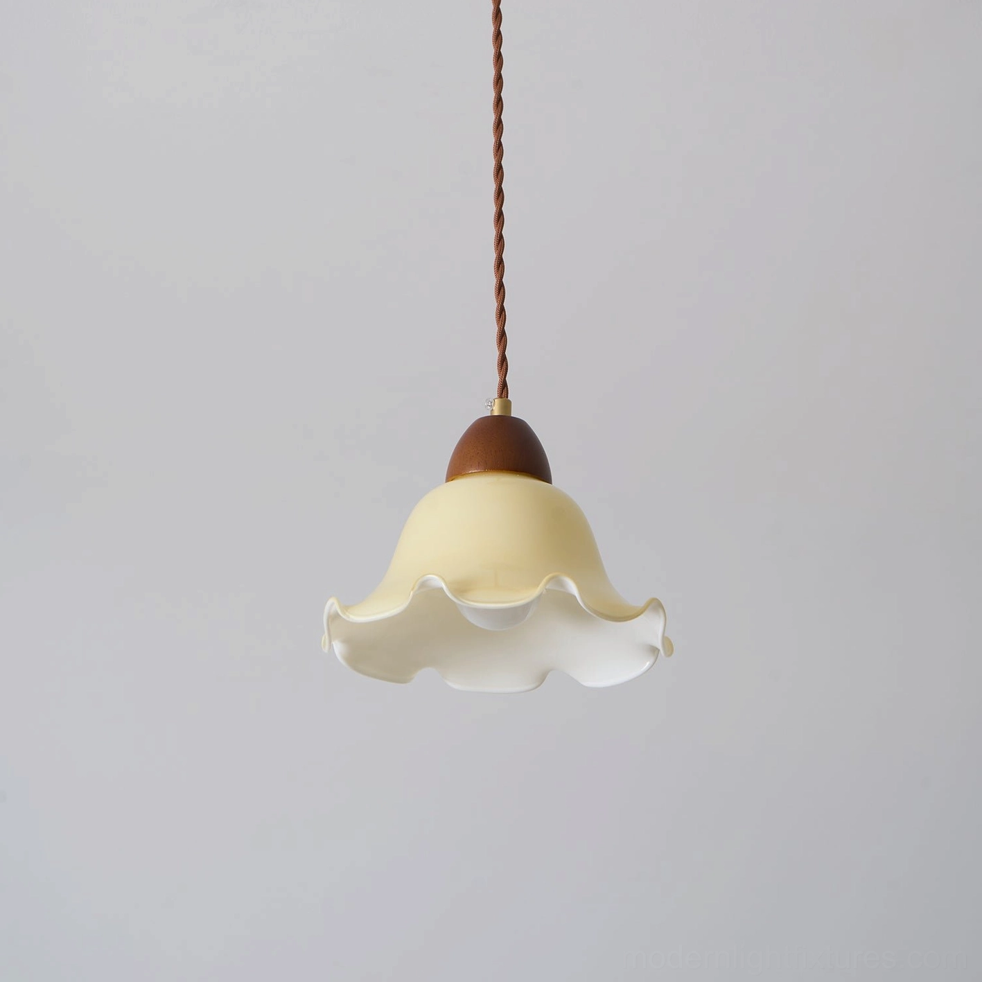 Rowan flower pendant light paired with mid-century modern furniture in sophisticated interior setting
