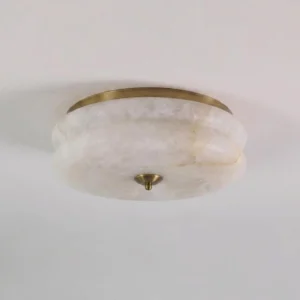 Rowen natural alabaster flush mount ceiling light, side overhead close-up showing authentic stone veining and brass trim ring detail