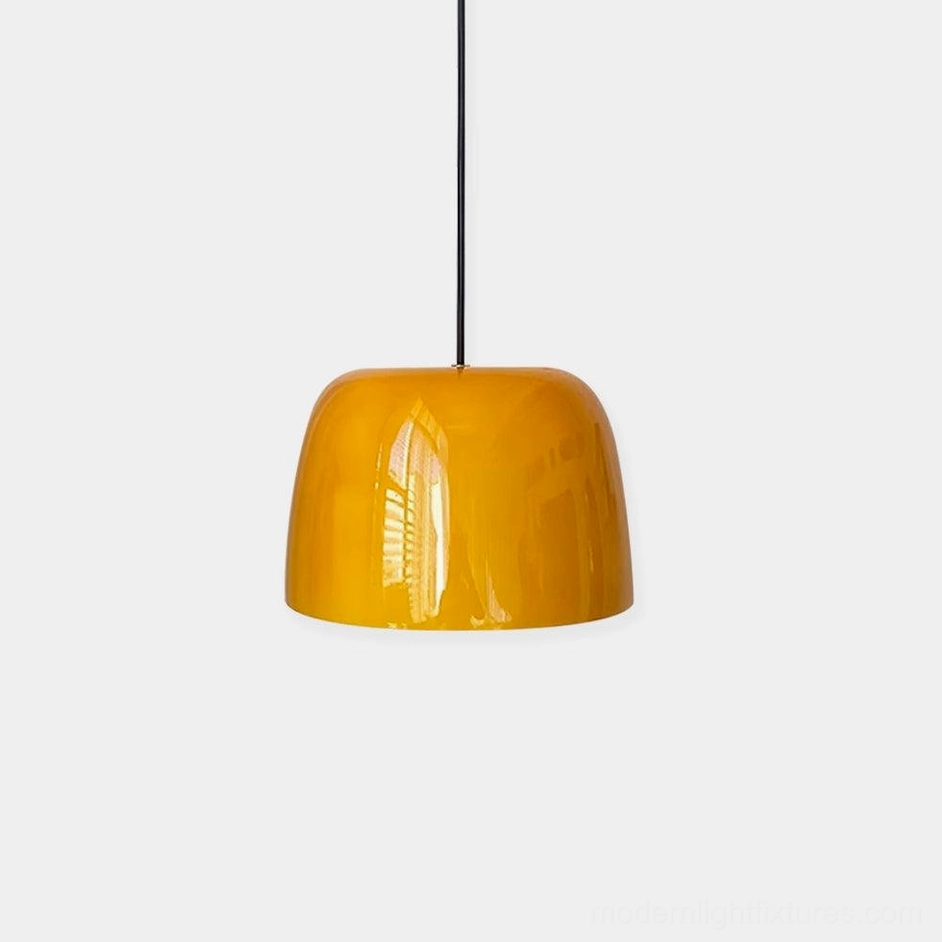 Roxboro glossy amber glass pendant light close-up studio photography showing fixture quality and finish