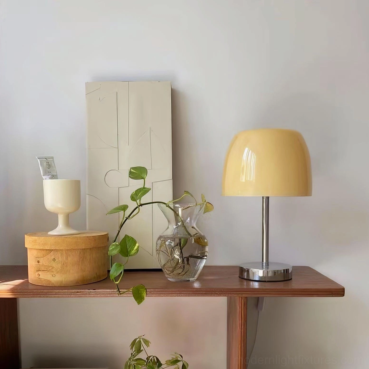 Compact mid-century modern Roxboro glass table lamp on accent table