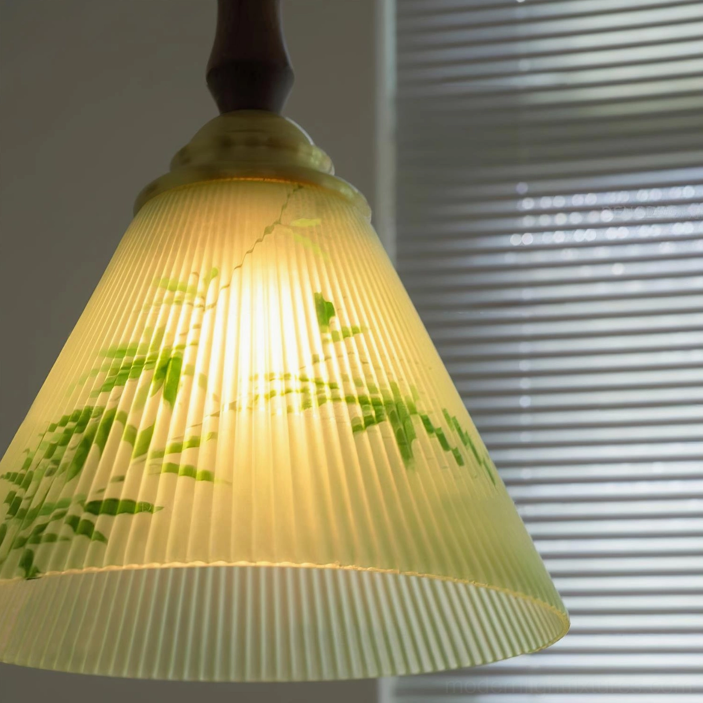 Royale Botanical Pendant Light in dining or entryway setting showcasing botanical elegance and warm glow