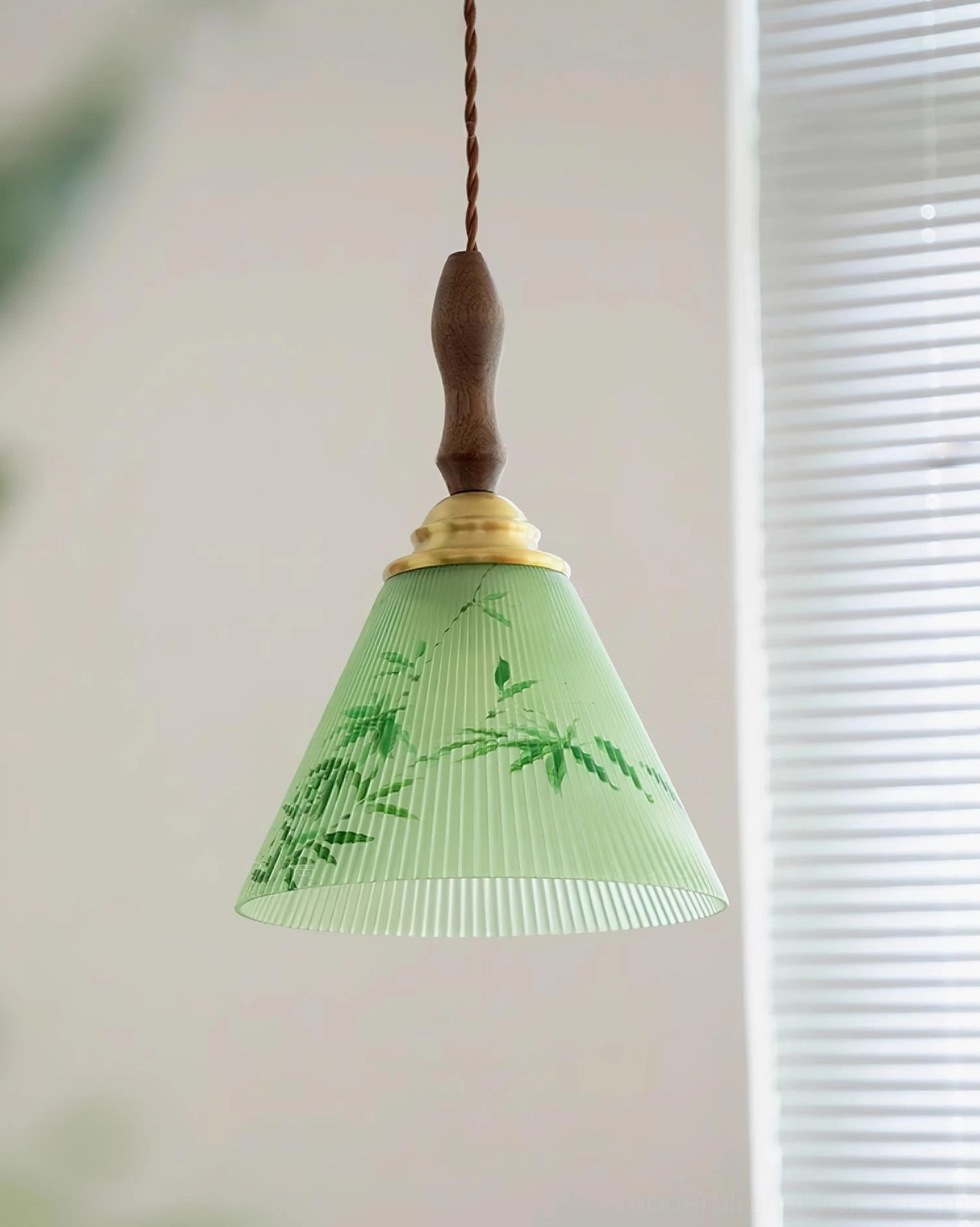 Side view of botanical pendant light showing ribbed glass shade, brass and walnut wood hardware accents