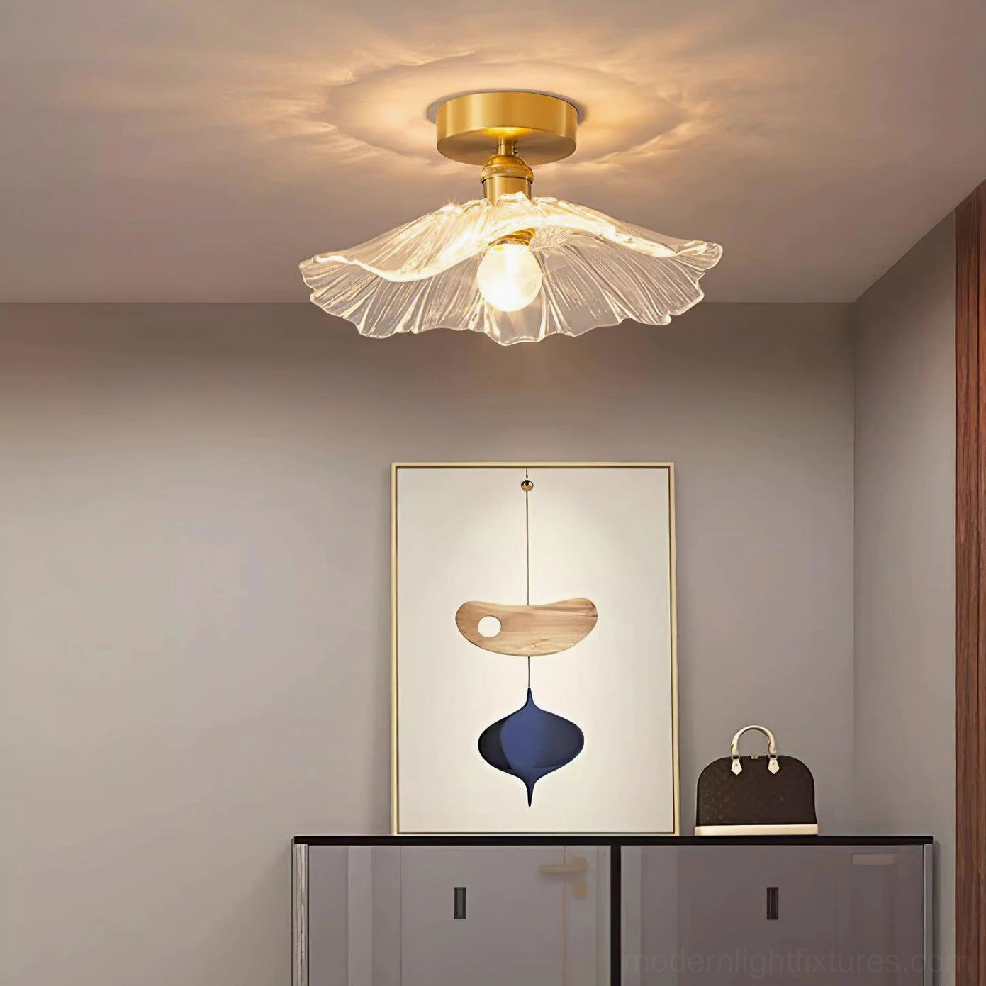 Ruffled glass ceiling light fixture installed creating atmospheric illumination in modern residential interior design